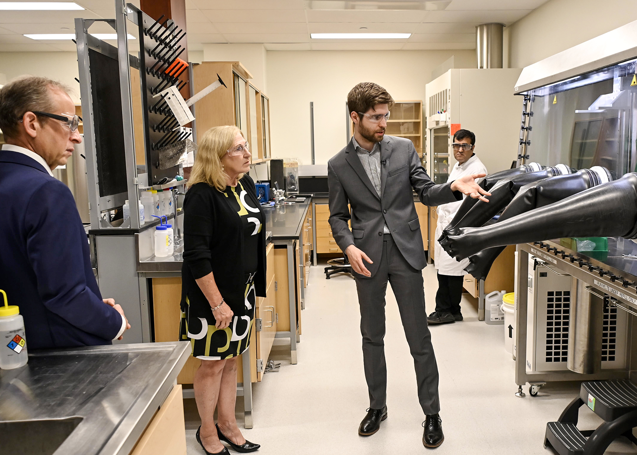 Dr. Arthur Situm explaining the molten salt glove box in his Small Modular Reactors (SMRs) Fuel Corrosion Laboratory. (Photo courtesy of Innovation Saskatchewan)